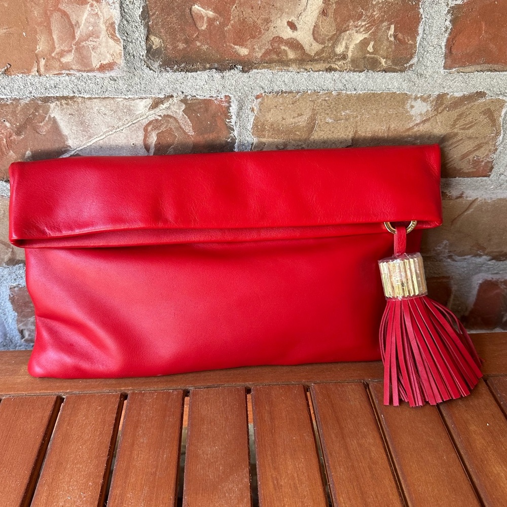 India Hicks Red Fold-Over Leather Clutch with Tassel Accent